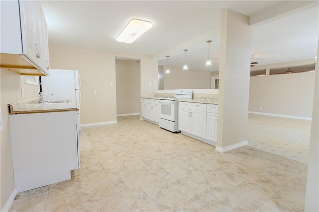 1553 Casa Grande Dr, Corpus Christi, TX 78411 - kitchen featuring white appliances, white cabinetry, light countertops, pendant lighting, and light floors