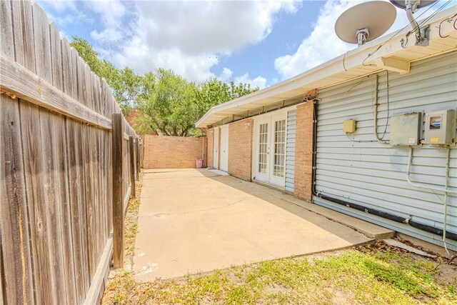 1553 Casa Grande Dr, Corpus Christi, TX 78411 - fenced backyard featuring a patio area and french doors