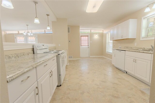 1553 Casa Grande Dr, Corpus Christi, TX 78411 - kitchen featuring white appliances, a sink, a chandelier, white cabinets, and light stone countertops