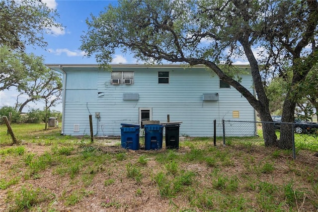 back of property featuring fence
