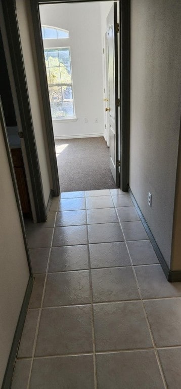 corridor with tile patterned flooring