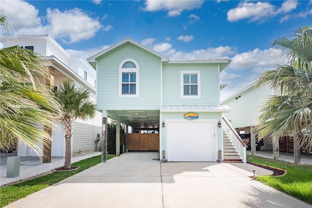 330 Paradise Pointe Dr, Port Aransas, TX 78373 - beach home with a carport, concrete driveway, stairway, and an attached garage
