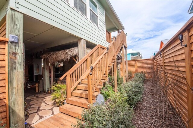 330 Paradise Pointe Dr, Port Aransas, TX 78373 - view of side of property with fence and stairs