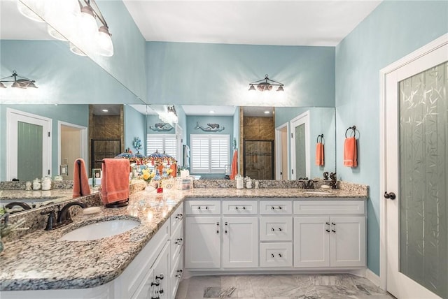 330 Paradise Pointe Dr, Port Aransas, TX 78373 - bathroom featuring a shower stall, marble look tile flooring, and double vanity