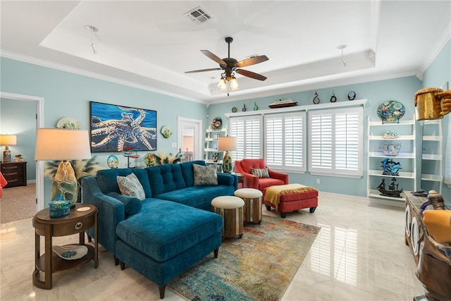 living room featuring crown molding, ceiling fan, and a raised ceiling