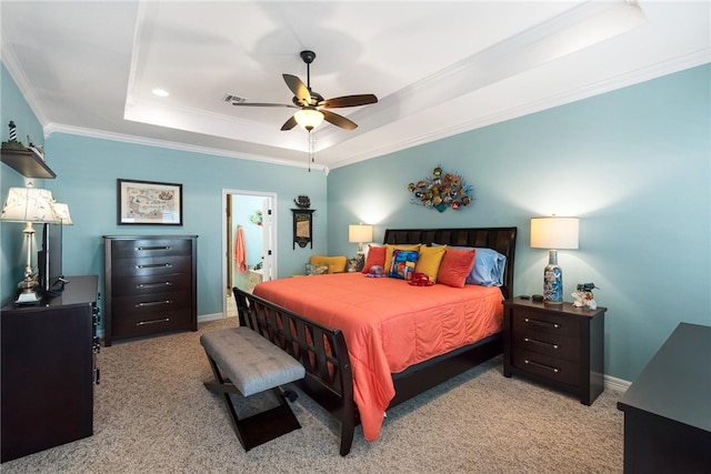 carpeted bedroom with ceiling fan, a raised ceiling, and crown molding