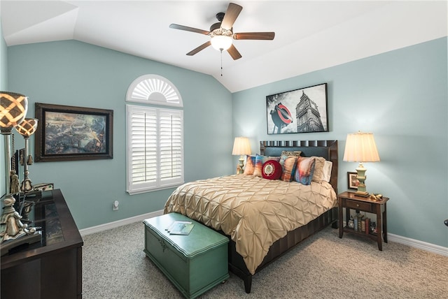 bedroom with lofted ceiling, ceiling fan, and carpet floors