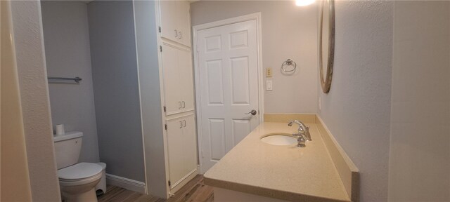 bedroom with dark hardwood / wood-style floors and ceiling fan