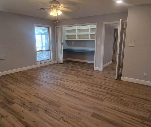 bedroom featuring dark hardwood / wood-style flooring and ceiling fan