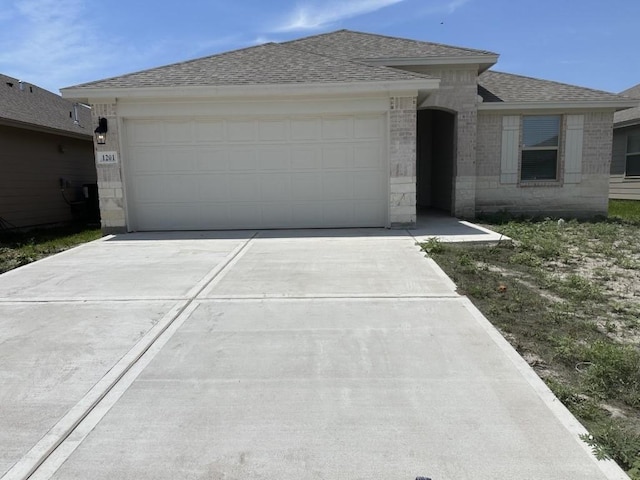 1201 Thames Chase Dr, Corpus Christi, TX 78415 - ranch-style home featuring driveway, a shingled roof, a garage, and brick siding