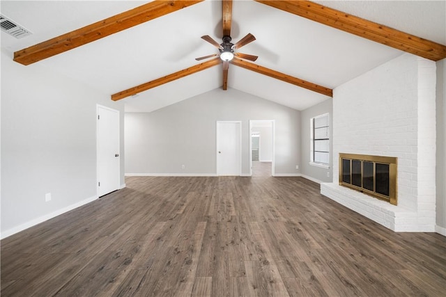 unfurnished living room featuring visible vents, a ceiling fan, wood finished floors, vaulted ceiling with beams, and a fireplace