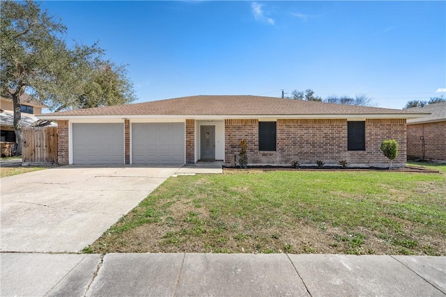 ranch-style home with driveway, brick siding, a garage, and a front yard