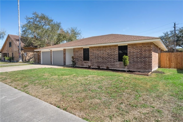 single story home featuring a garage, driveway, fence, a front lawn, and brick siding