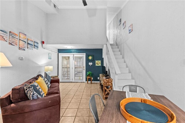 14300 S Padre Island Dr Unit 200, Corpus Christi, TX 78418 - living room featuring light tile patterned floors and stairway