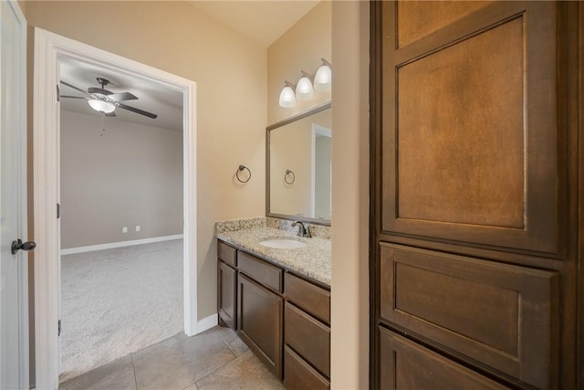 bathroom with tile patterned floors, ceiling fan, and vanity