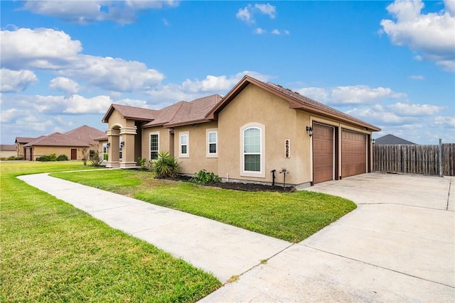 ranch-style house featuring a front lawn and a garage