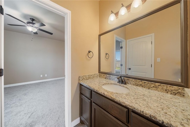 bathroom with ceiling fan and vanity