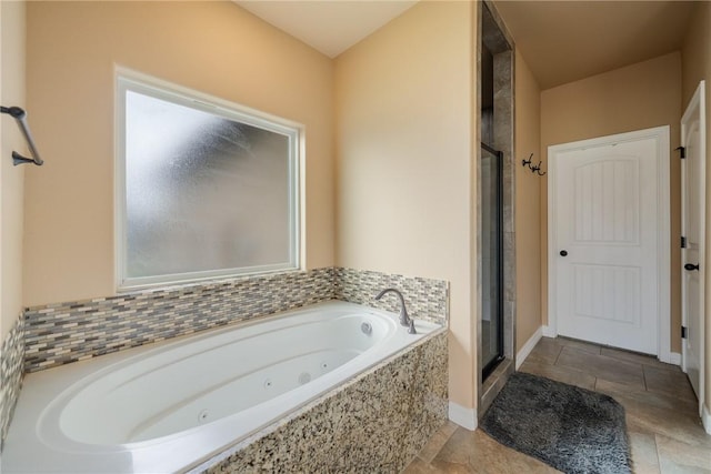 bathroom featuring plenty of natural light and plus walk in shower