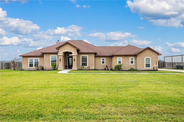 ranch-style house with a front lawn