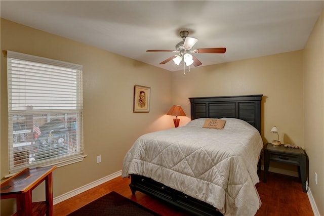 bedroom with ceiling fan and dark wood-type flooring