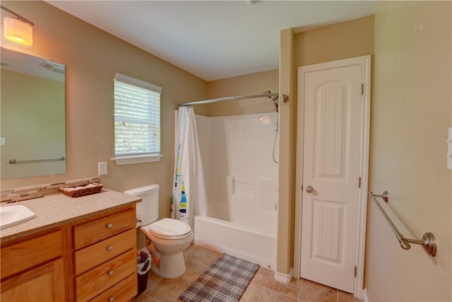 full bathroom with tile patterned flooring, vanity, toilet, and shower / bathtub combination with curtain