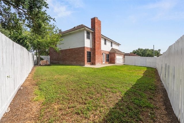 7030 Chiswick Dr, Corpus Christi, TX 78413 - back of property with brick siding, a fenced backyard, a patio, a chimney, and a gate
