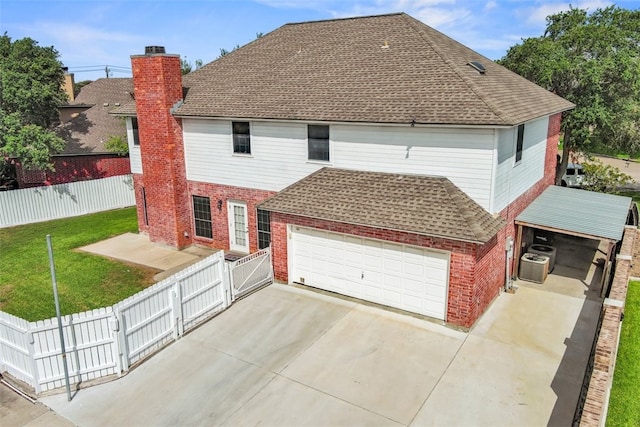 7030 Chiswick Dr, Corpus Christi, TX 78413 - rear view of house with brick siding, a gate, a shingled roof, and a chimney