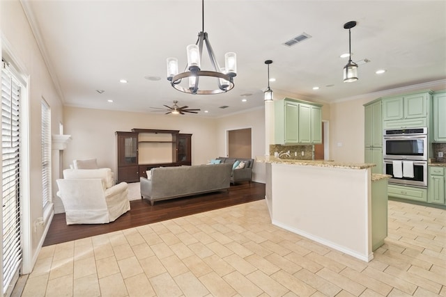7030 Chiswick Dr, Corpus Christi, TX 78413 - kitchen featuring green cabinetry, stainless steel double oven, tasteful backsplash, a chandelier, and crown molding