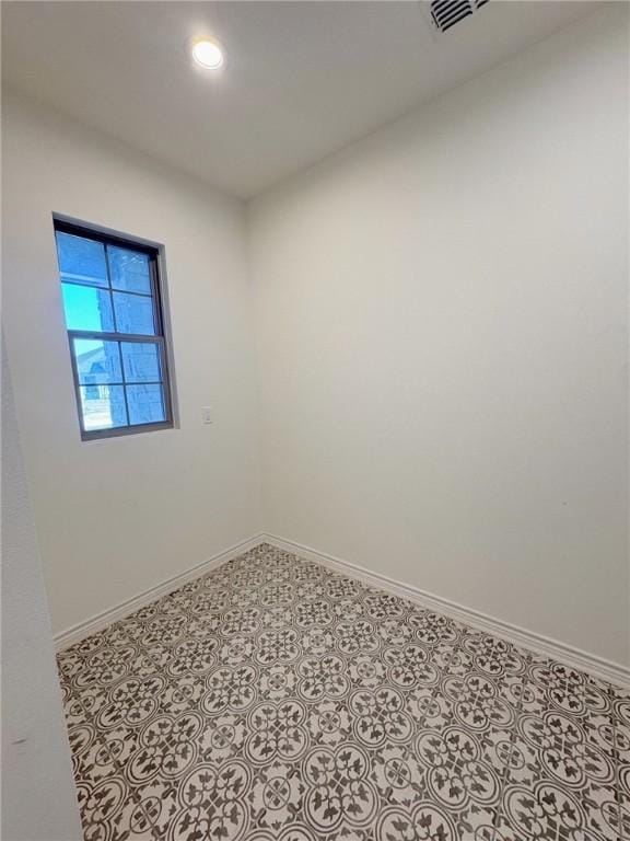 view of tiled spare room