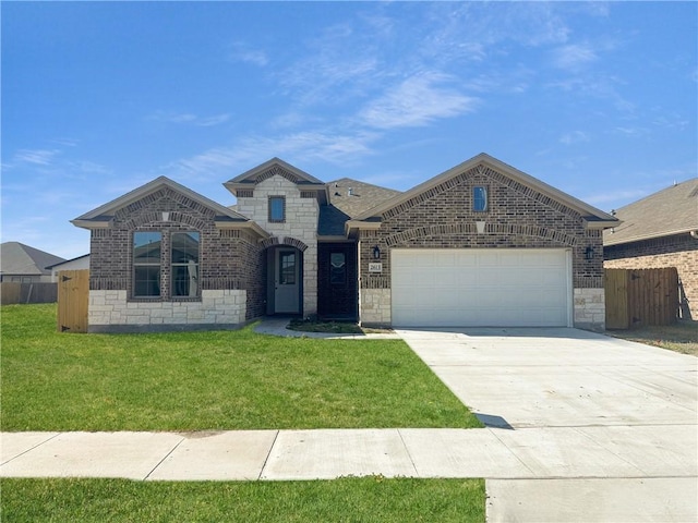 view of front of home with a garage and a front yard