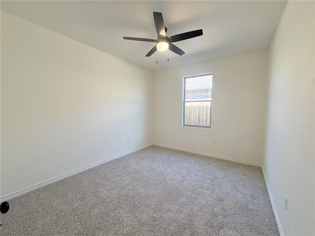 unfurnished room with ceiling fan and carpet floors