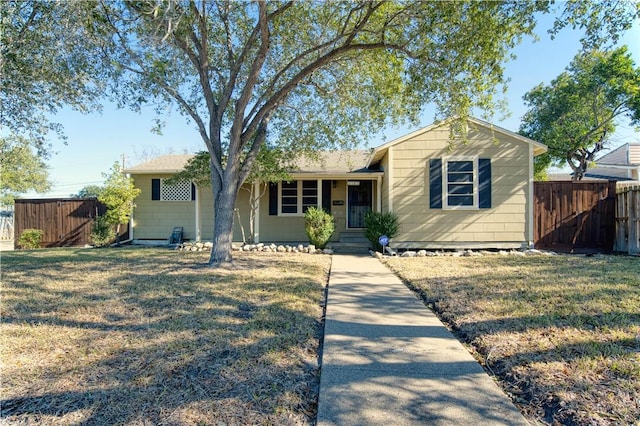 ranch-style house featuring a front lawn