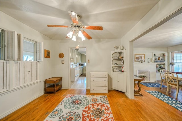 interior space with ceiling fan and light hardwood / wood-style flooring