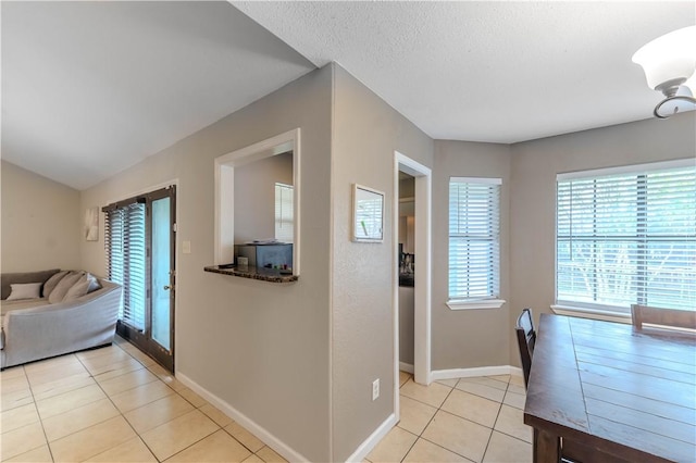 5929 Choctaw Dr, Corpus Christi, TX 78415 - entryway with light tile patterned floors, baseboards, and a textured ceiling