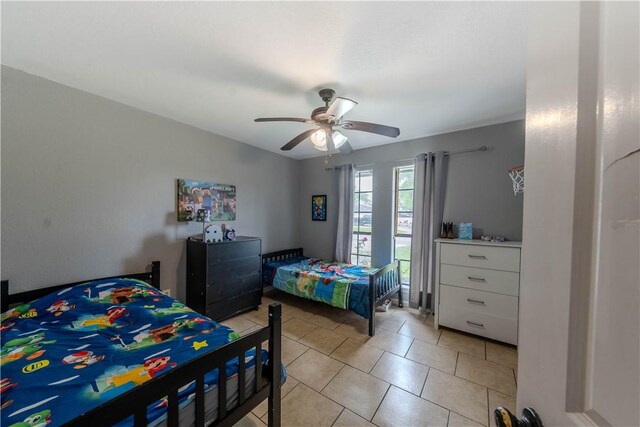 5929 Choctaw Dr, Corpus Christi, TX 78415 - bedroom featuring light tile patterned flooring and a ceiling fan