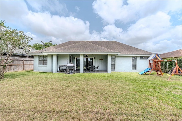 5929 Choctaw Dr, Corpus Christi, TX 78415 - back of house featuring a playground, a patio area, and roof with shingles