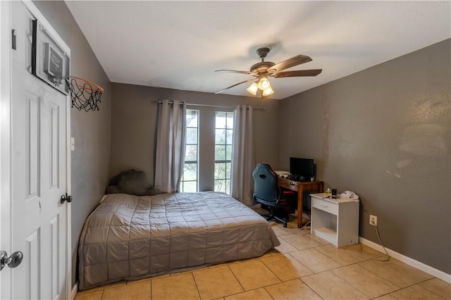 5929 Choctaw Dr, Corpus Christi, TX 78415 - bedroom featuring light tile patterned flooring, a ceiling fan, an office area, and baseboards