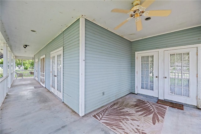 view of exterior entry with french doors and ceiling fan