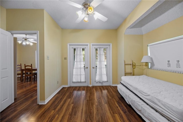 bedroom featuring dark wood-type flooring, ceiling fan, and access to exterior