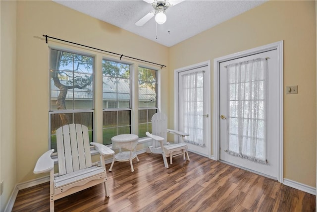 sunroom / solarium with ceiling fan