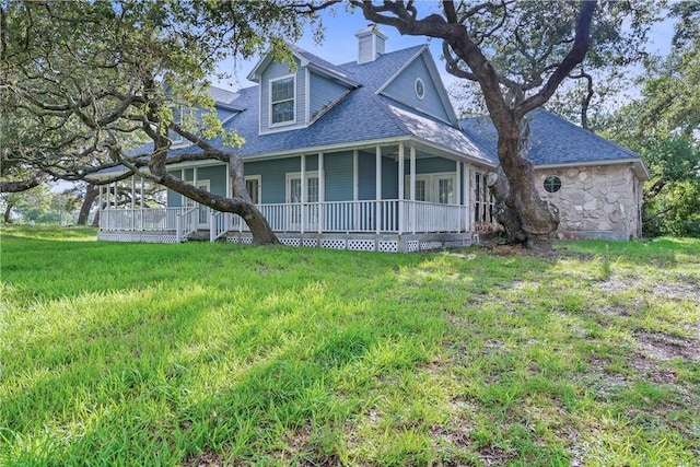 exterior space with a porch and a front yard