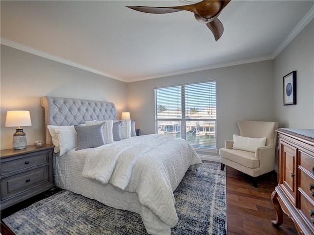 bedroom featuring ceiling fan, dark hardwood / wood-style floors, and ornamental molding