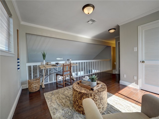 living area with dark hardwood / wood-style flooring and ornamental molding