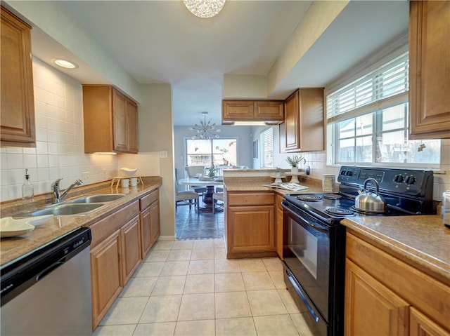 kitchen featuring dishwasher, black / electric stove, sink, and backsplash