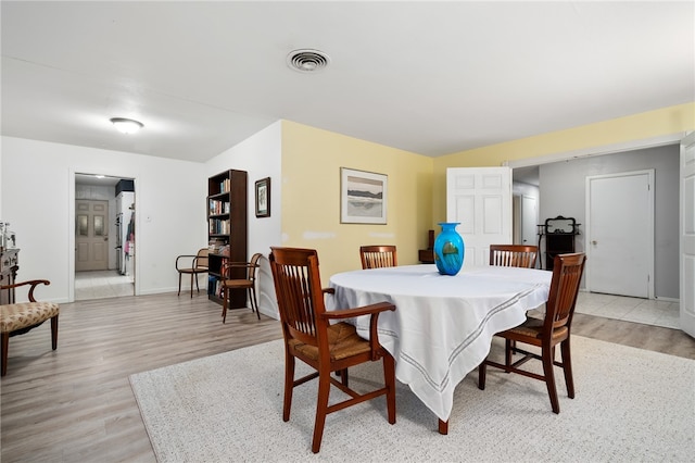 dining room featuring light hardwood / wood-style floors