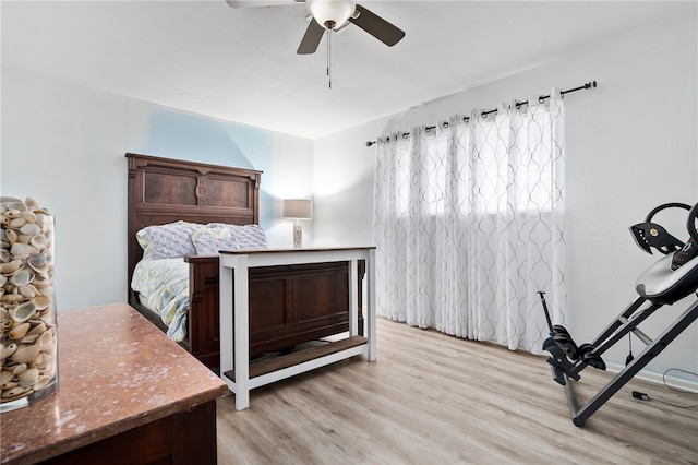 bedroom featuring ceiling fan and light hardwood / wood-style flooring