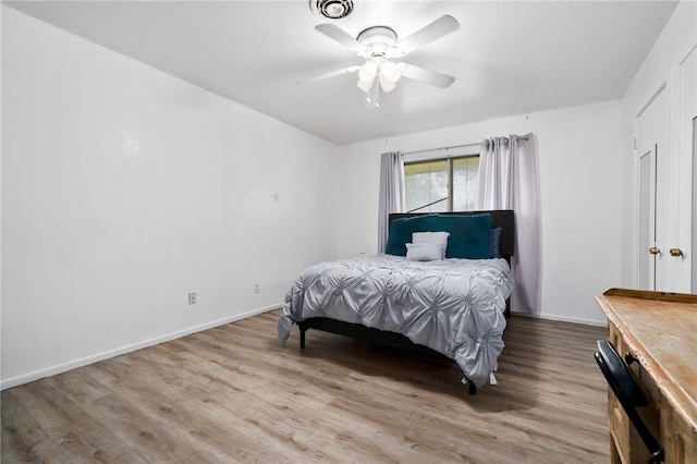 bedroom featuring ceiling fan and light hardwood / wood-style flooring