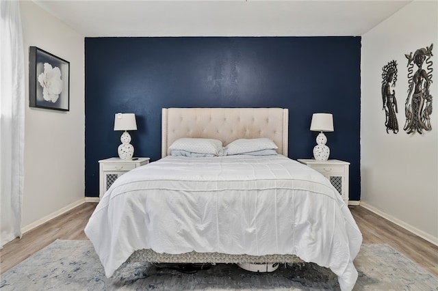 bedroom featuring hardwood / wood-style flooring