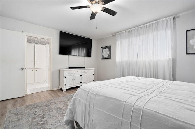 bedroom with ceiling fan and light wood-type flooring