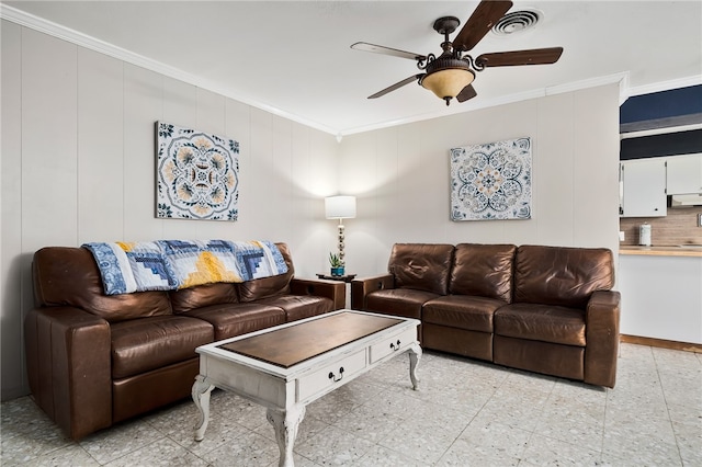 living room featuring ornamental molding and ceiling fan